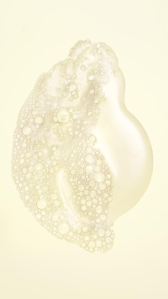 Oribe Hair Alchemy creamy lather texture demonstrating hydration benefit