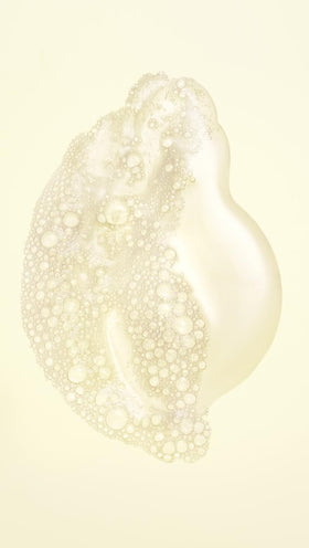 Oribe Hair Alchemy creamy lather texture demonstrating hydration benefit