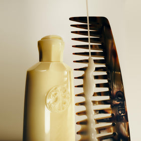 Oribe ingredient label close-up showing hyaluronic complex for hydration