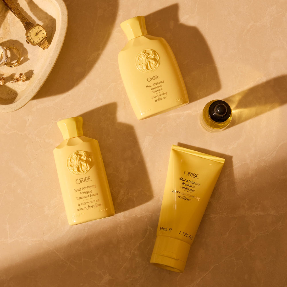 ORIBE open cap dispensing shampoo droplet for easy application