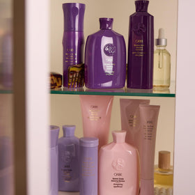 Oribe product paired with other haircare items showing integrated regimen benefit