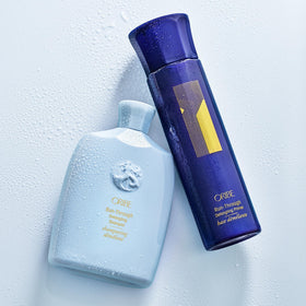 Oribe Run-Through on bathroom shelf with styling products suggesting polished routine