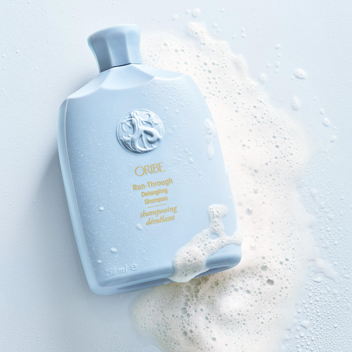 Detail of Oribe Run-Through label highlighting ingredients and silicone-free benefit