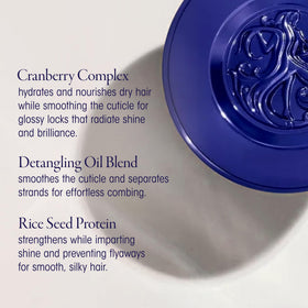 Oribe Run-Through being sprayed into hand illustrating easy application and conditioning benefit