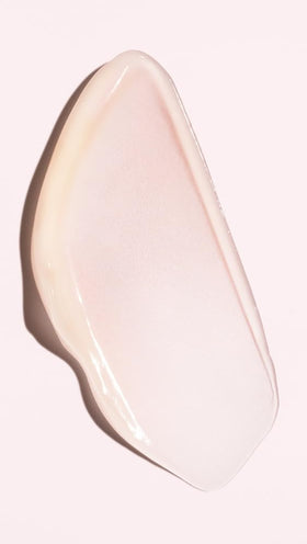 ORIBE Serene Scalp being applied to scalp in hand demonstrating targeted, leave-on application and cooling relief
