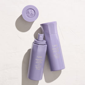 ORIBE Serene Scalp mist applied to dry roots in salon scene, illustrates oil-control benefit