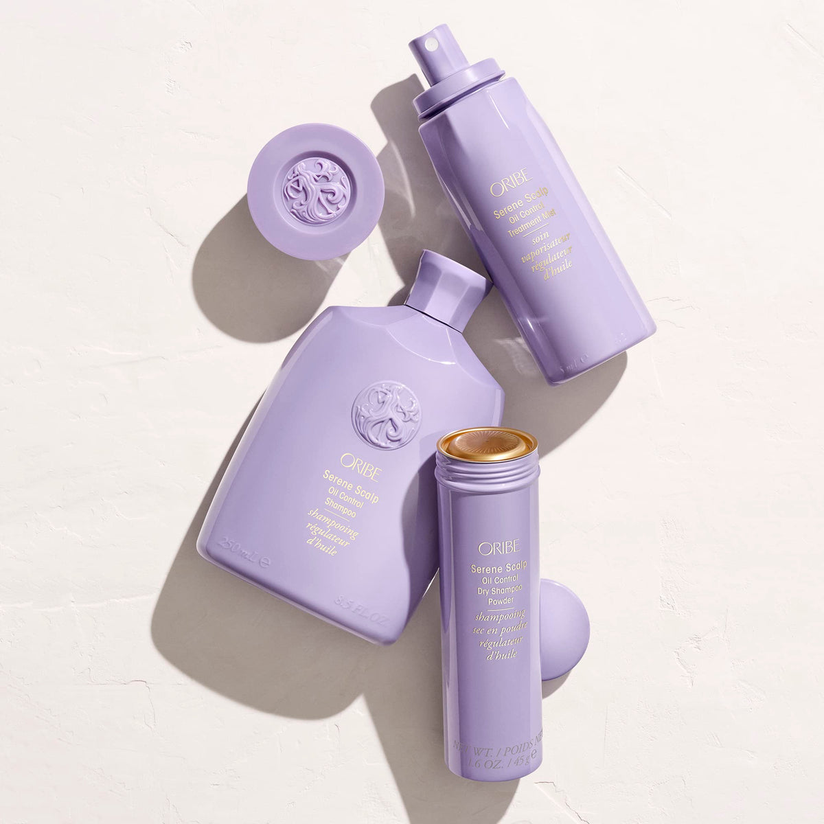 ORIBE Serene Scalp mist held in hand for scale, demonstrates travel-friendly 4.2 oz benefit