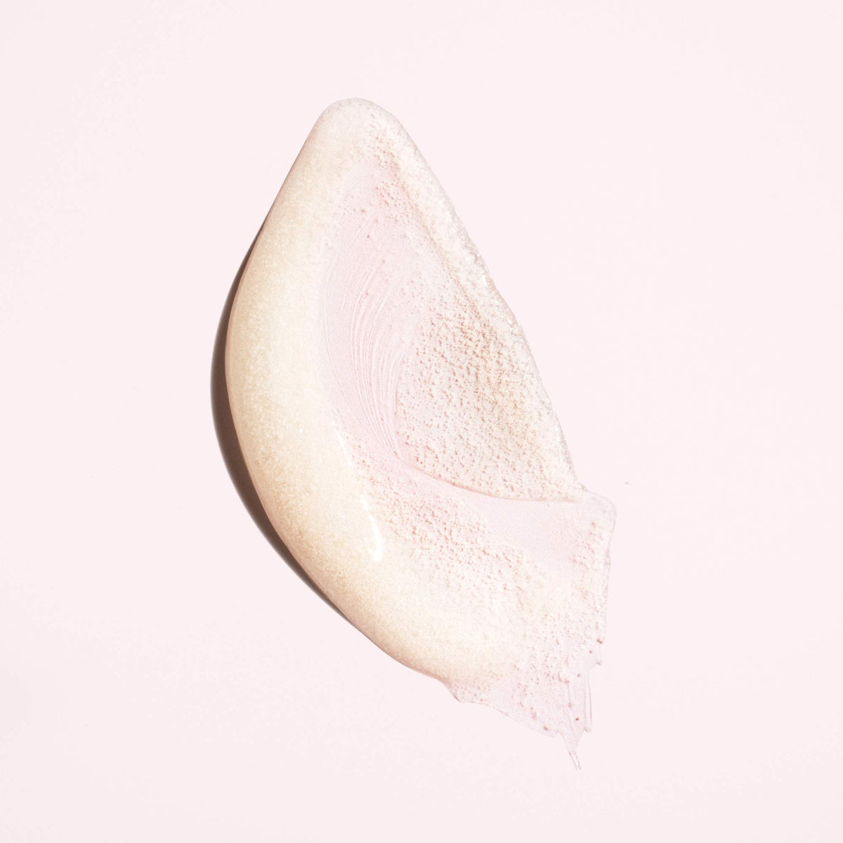 Oribe serene scalp scrub applied to wet hair in shower demonstrating deep-clean benefit