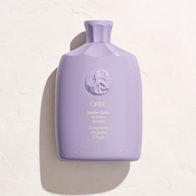 Oribe shampoo in shower scene demonstrating refreshed roots and volume