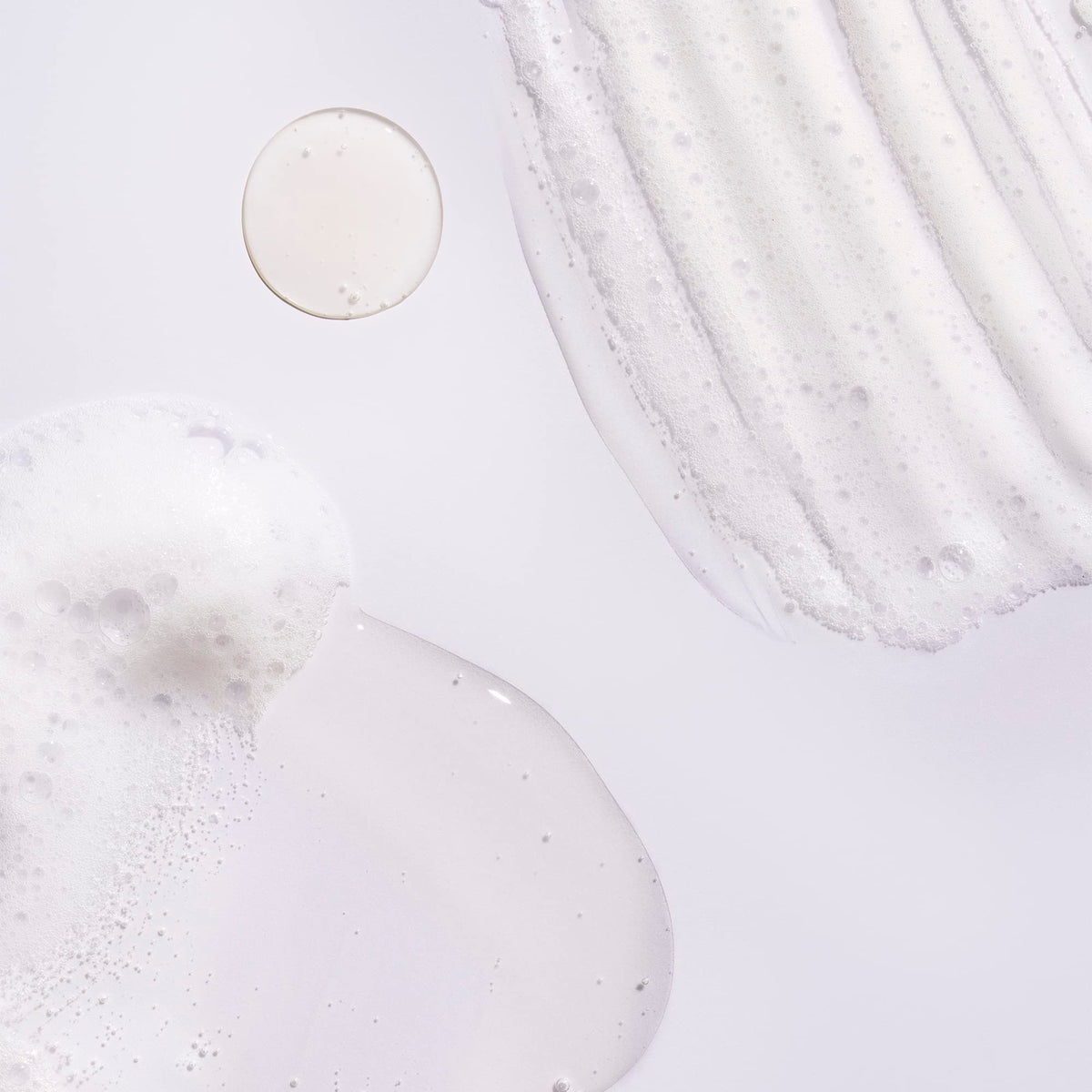 Oribe shampoo lather texture illustrating gentle cleansing and oil removal