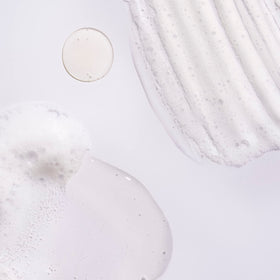 Oribe shampoo lather texture illustrating gentle cleansing and oil removal