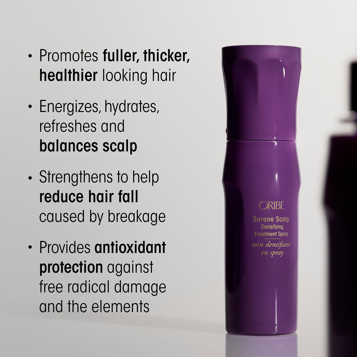 Oribe spray nozzle detail ready for targeted scalp application and precision