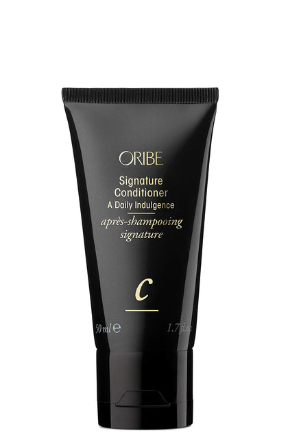 Oribe Signature Conditioner front packaging showing compact travel bottle and elegant design benefit lightweight luxury