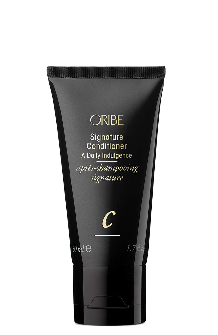 Oribe Signature Conditioner front packaging showing compact travel bottle and elegant design benefit lightweight luxury