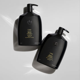 Oribe signature conditioner applied in shower demonstrating smooth detangling benefit
