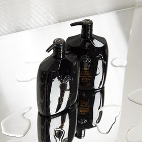 Oribe signature conditioner being worked through mid-lengths to improve manageability
