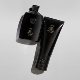 Oribe liter refill on bathroom shelf suggesting everyday luxury use