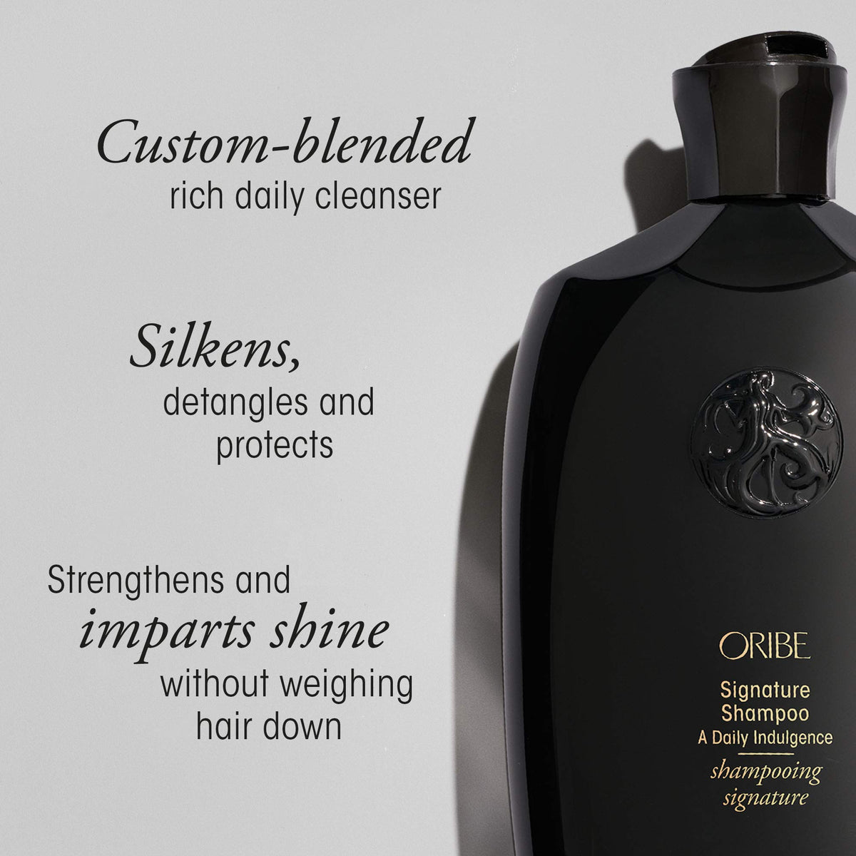 Hand pouring Oribe refill into a pump bottle for easy transfer