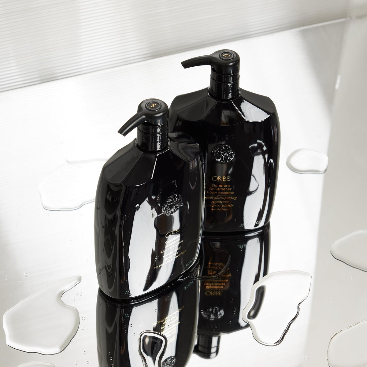 Oribe 33.8 oz size comparison illustrating value and longevity