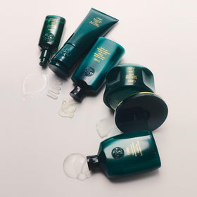 Oribe jar next to hand for size comparison indicating 6.7oz capacity benefit