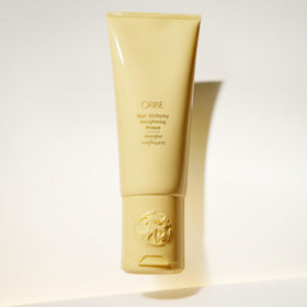 Oribe jar held in hand for size comparison showing portable luxury