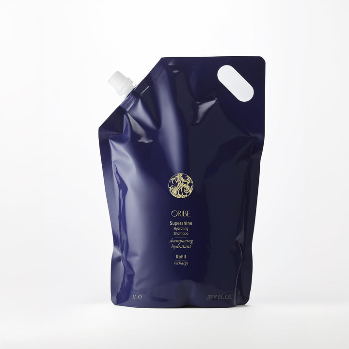 Oribe supershine front packaging showing elegant refill bottle and brand benefit