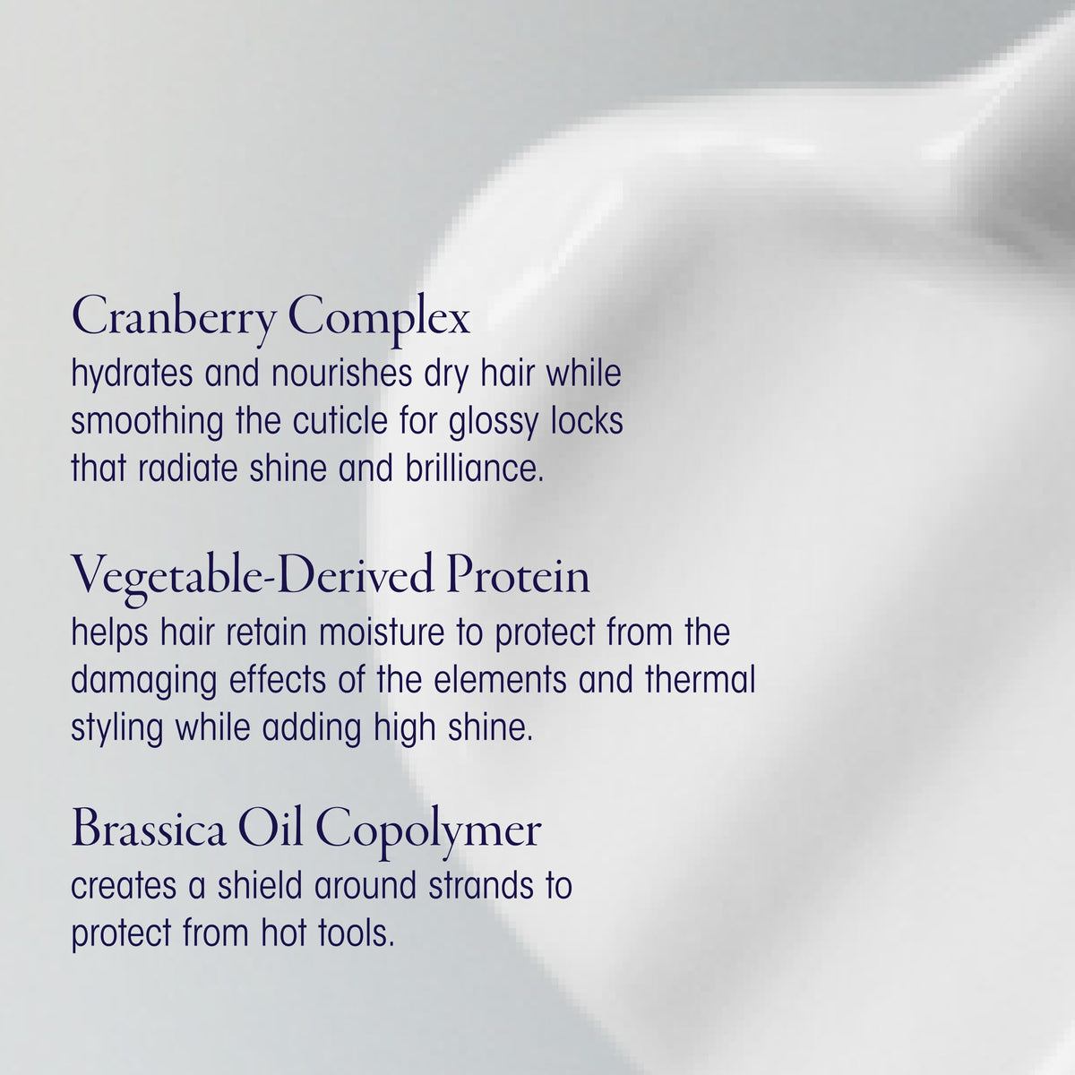 Applying Oribe Supershine Light in hand to show easy spread and control