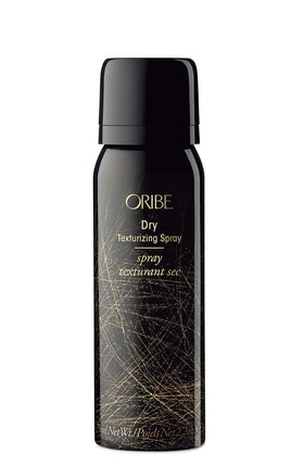 Oribe travel kit size comparison beside passport showing TSA-friendly convenience benefit