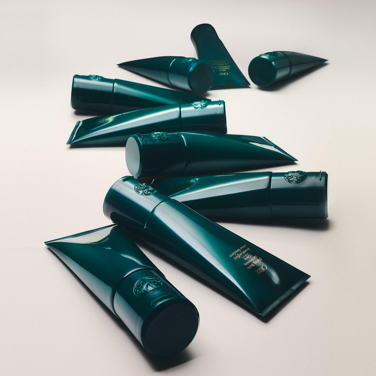 Oribe applied to damp hair showing enhanced curl definition and frizz control