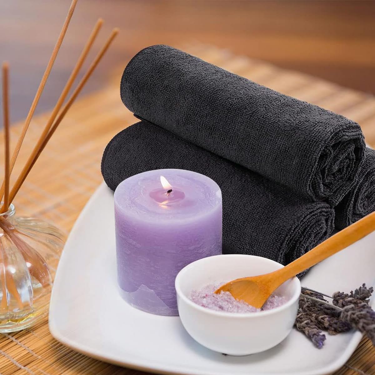 Orighty towels arranged in a spa setting conveying comfortable guest experience and versatility