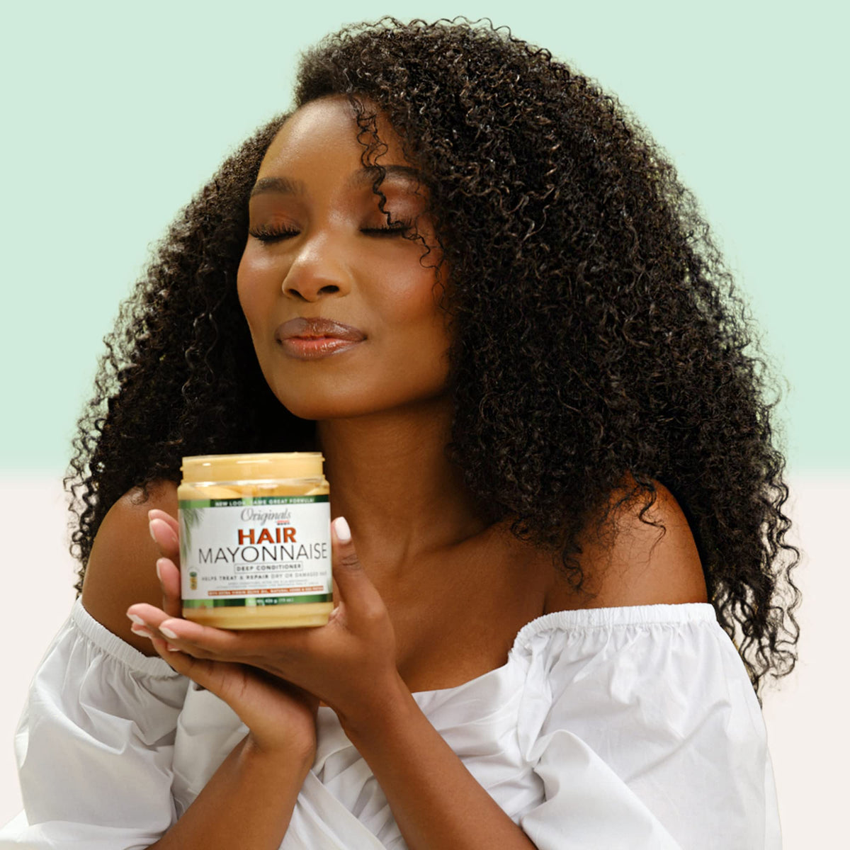 Originals by Africa's Best application on curly hair in salon demonstrating easier detangling and repair