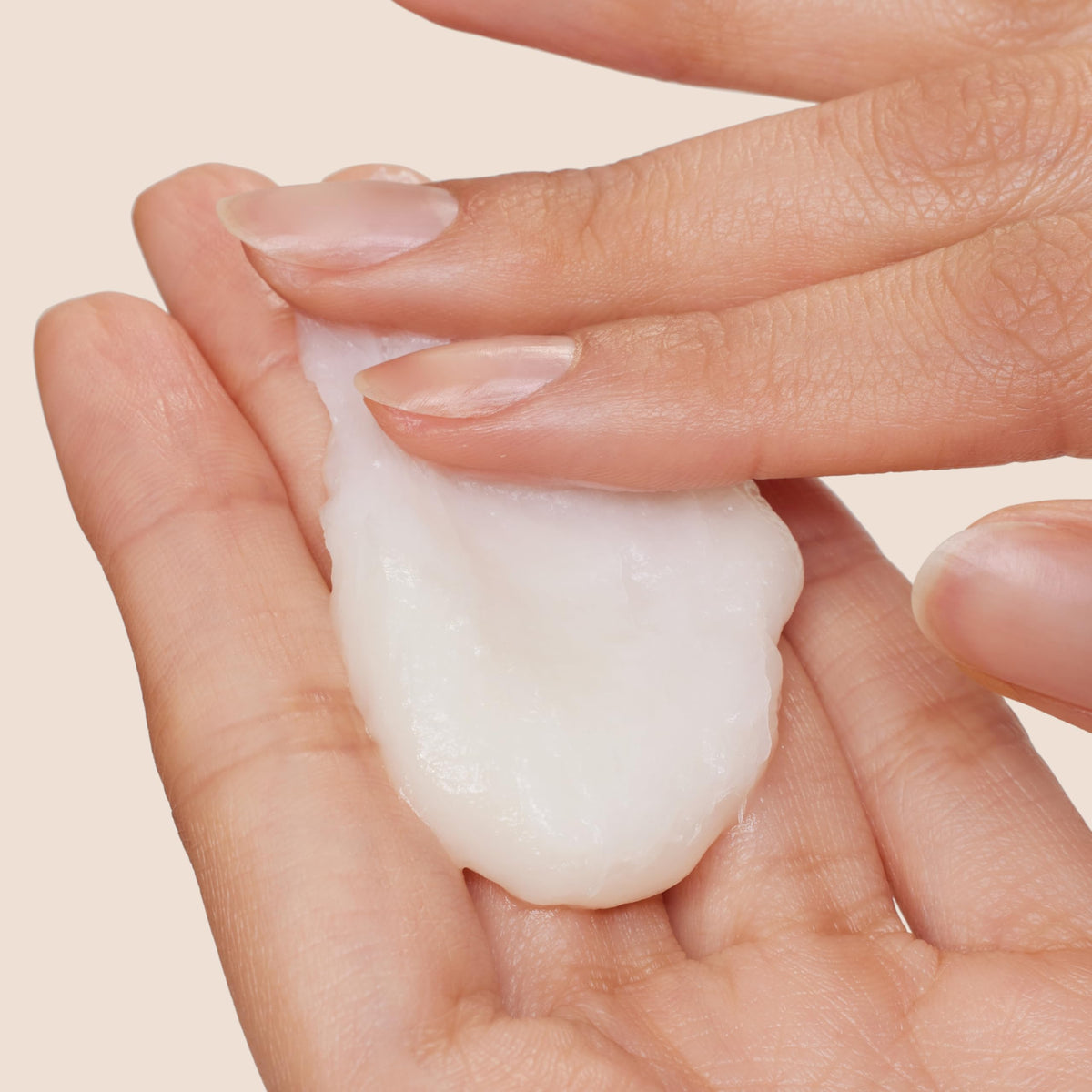 Origins cream applied to heel demonstrating smoothing benefit