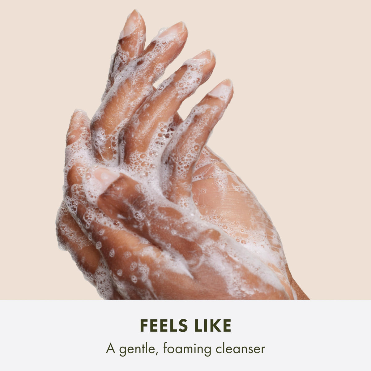 Origins Plantscription lather on hand demonstrating gentle foam and soft cleansing