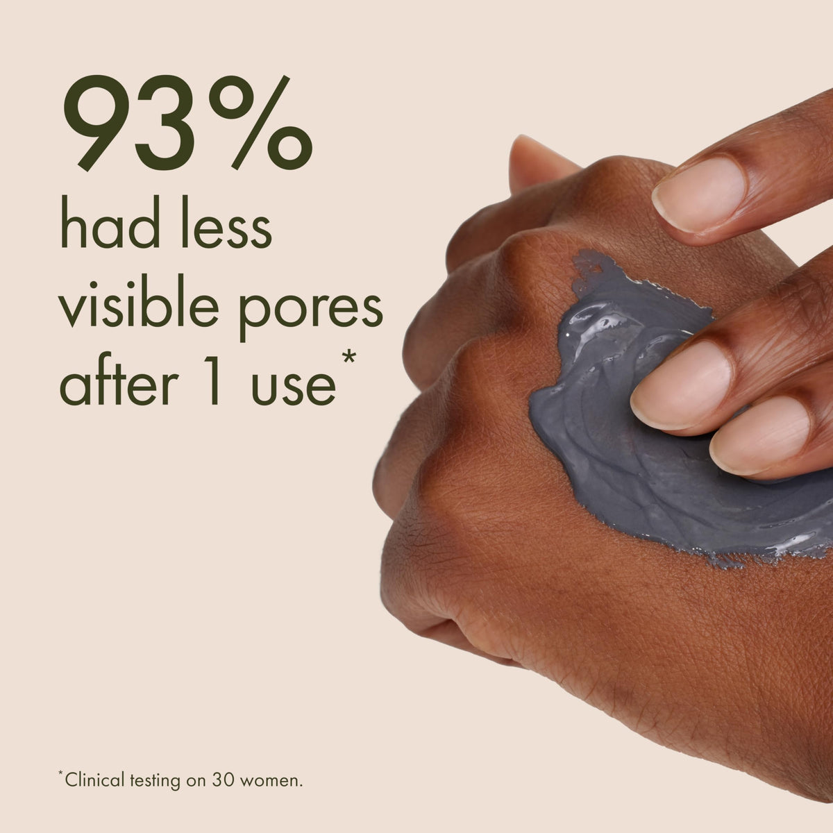 Origins travel-size tube in hand to show scale and portability for on-the-go use