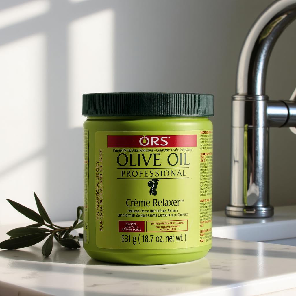 ORS applying creme relaxer to hair section for smooth, controlled application