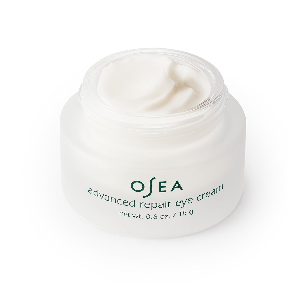 OSEA jar next to coin illustrating 0.6 oz size for easy portability