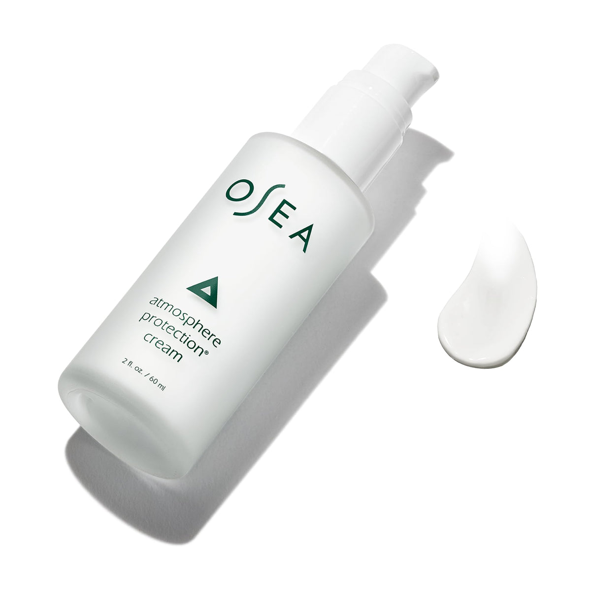 OSEA applying cream to cheek illustrating quick absorption and smoothing