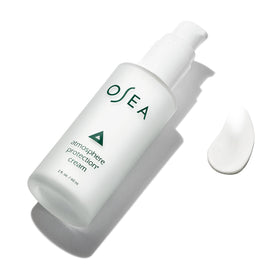 OSEA applying cream to cheek illustrating quick absorption and smoothing