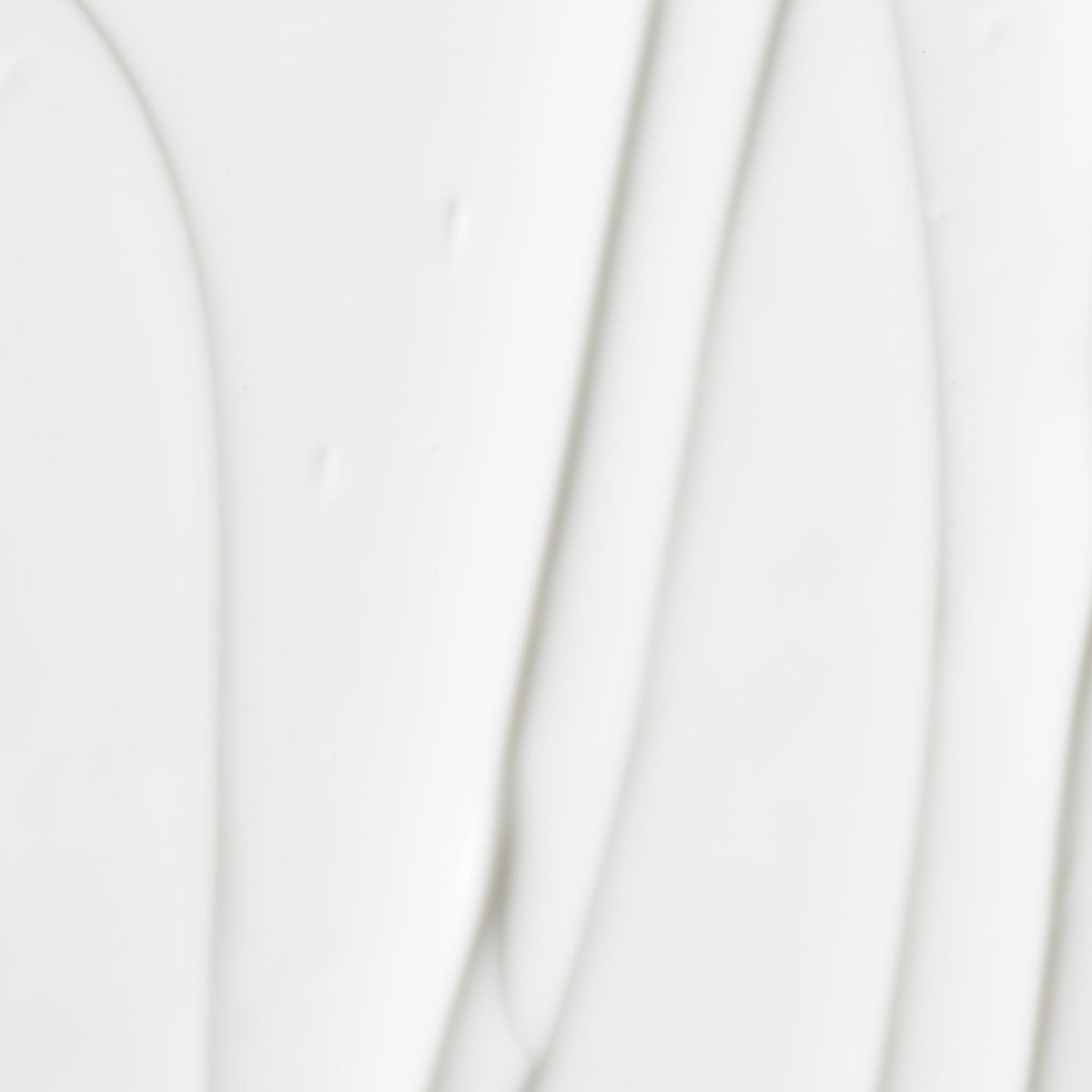 OSEA cream texture close-up swipe highlighting fast-absorbing silky finish
