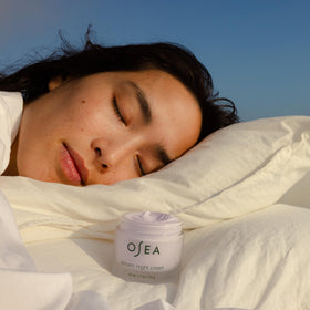 OSEA cream in hand demonstrating size and easy application benefit