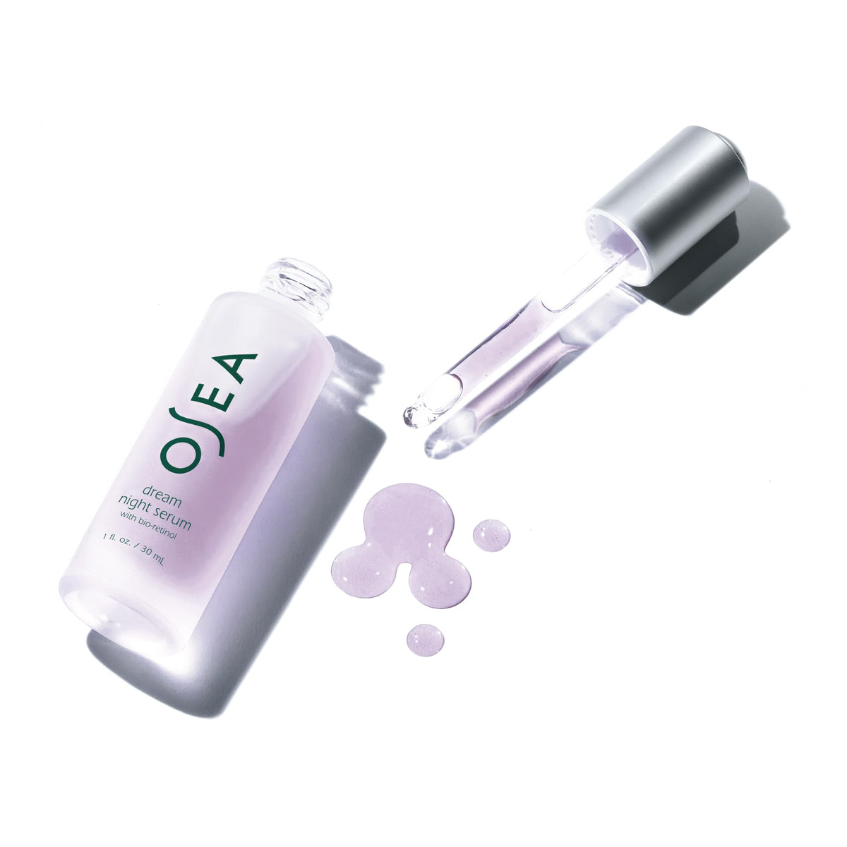 OSEA serum in hand for scale showing 1oz size and travel-friendly benefit