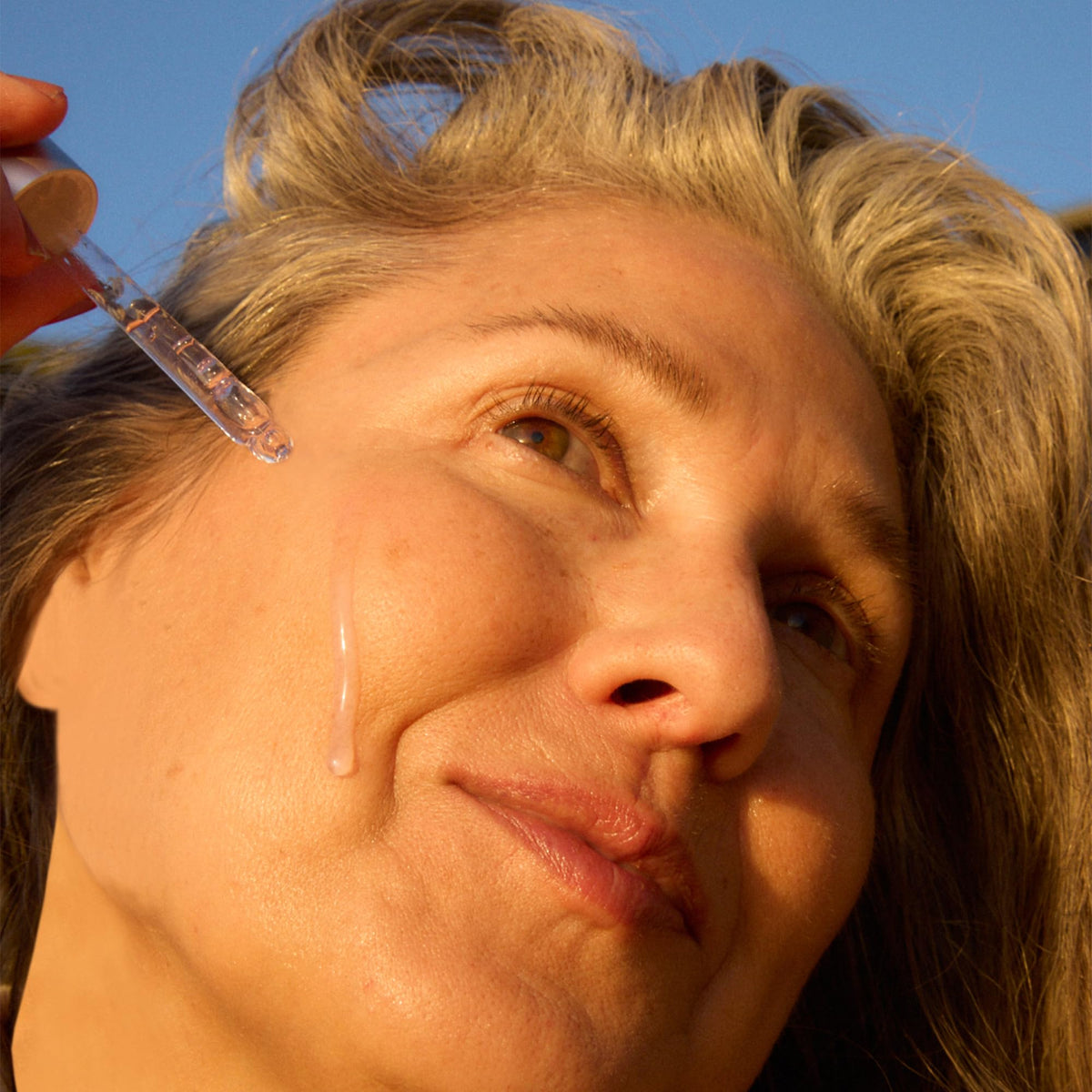 OSEA pipette dispensing serum texture demonstrating smooth, hydrating application