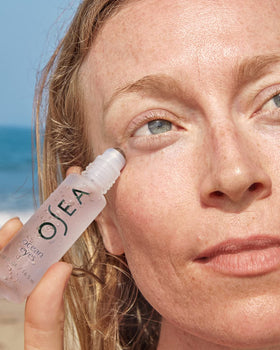 OSEA translucent gel texture on fingertip highlighting hydrating, lightweight feel
