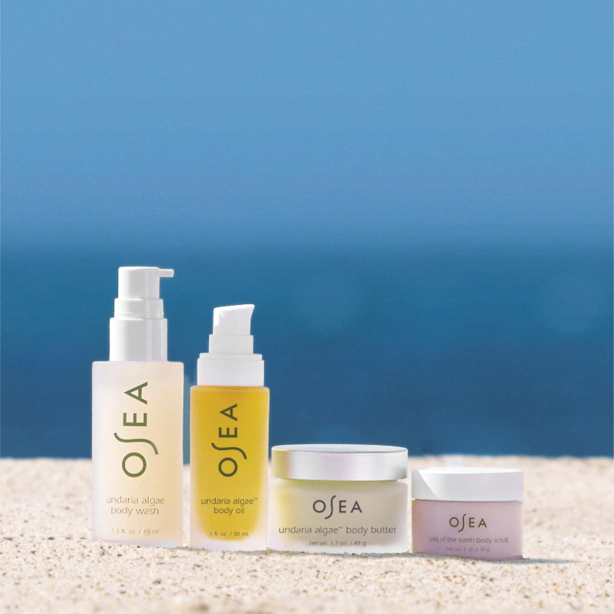 OSEA Salts of the Earth Body Scrub in hand demonstrating exfoliation for smoother glowing skin