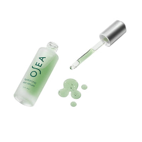 OSEA serum smoothed on skin demonstrating dewy finish and instant moisturization