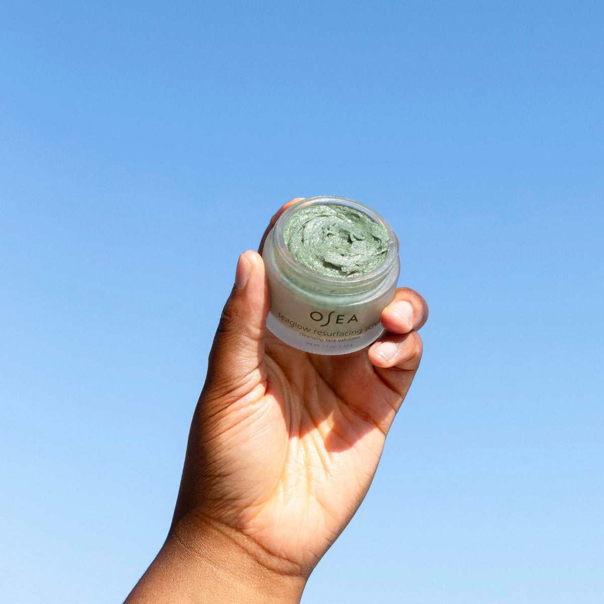 OSEA Seaglow on bathroom shelf staged with towel for a routine‑ready skincare benefit