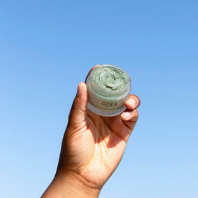 OSEA Seaglow on bathroom shelf staged with towel for a routine‑ready skincare benefit