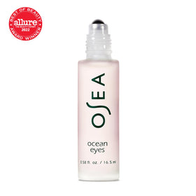 OSEA serum being rolled under eye demonstrating de-puffing and smoothing effect
