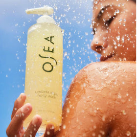 OSEA bottle next to ruler illustrating the compact 8oz travel-friendly benefit