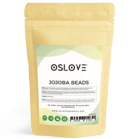Hand holding Oslove Organics beads ready to apply for gentle exfoliation